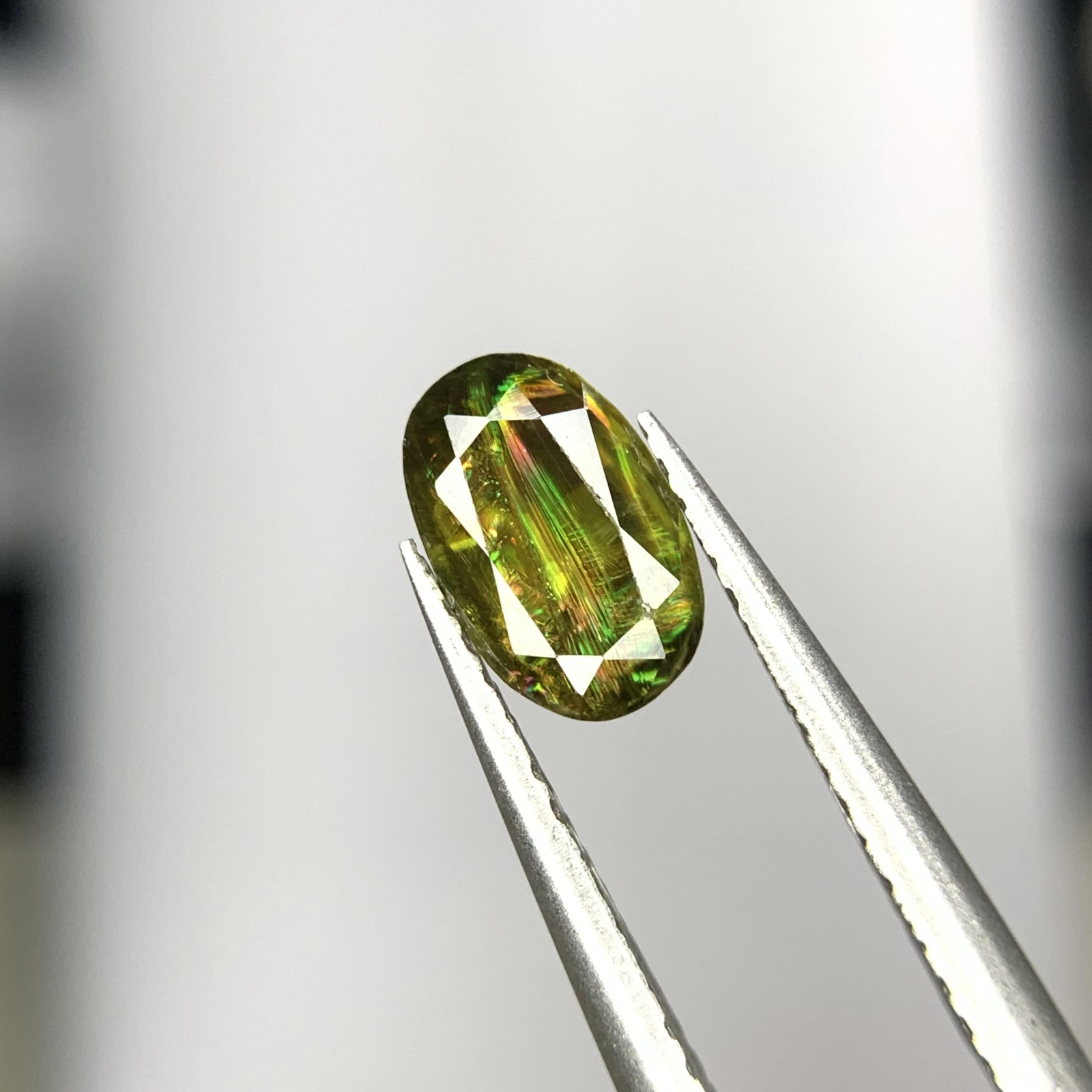 1.25ct Natural Sphene Titanite gemstone with horsetail oval shape — view 1