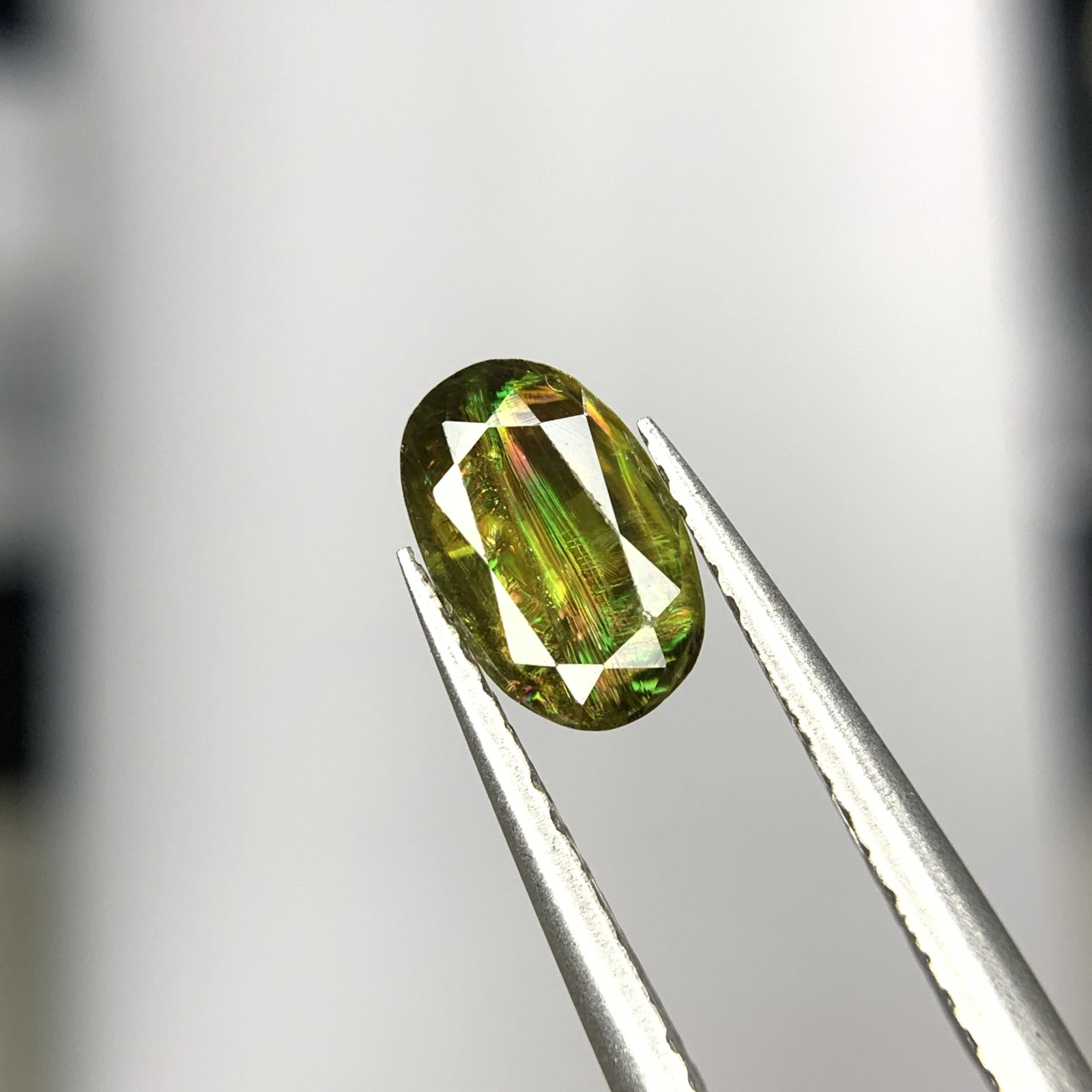 1.25ct Natural Sphene Titanite gemstone with horsetail oval shape — view 4